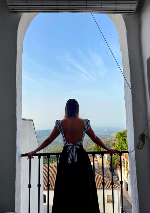 Liza on the balcony of the Molino Escamillos apartment, with a view